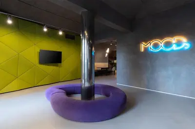 a room with a purple ring in front of a neon sign at MOODs boutique hotel in Prague