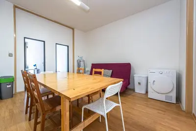 a dining room with a wooden table and chairs at Apartments Stepanska 36 in Prague