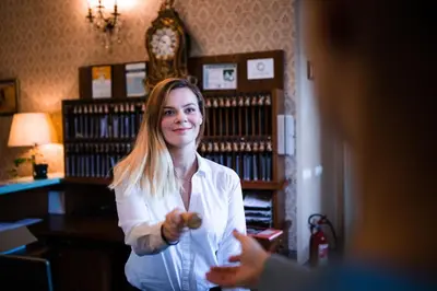 a woman standing in a room with a person at Château Liblice in Byšice