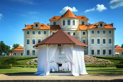 a gazebo in front of a large building at Château Liblice in Byšice