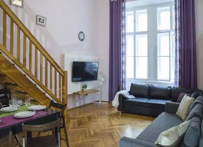 a living room with a couch and a table at Apartment Jindrisska 25 in Prague