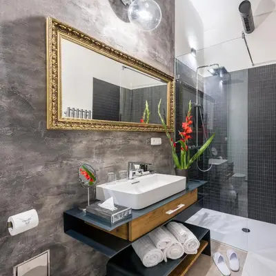a bathroom with a sink and a mirror at MOOo by the Castle in Prague