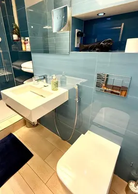 a bathroom with a sink and a toilet at LUXURY Apartment Dlouha in Prague