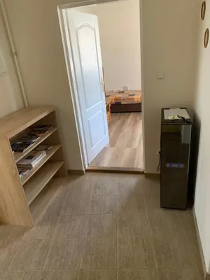 a room with a door and a mirror and a hallway at U Lokálky in Zadní Třebaň