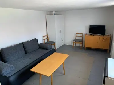 a living room with a couch and a table at U Lokálky in Zadní Třebaň