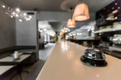 a bell sitting on a counter in a restaurant at Hotel Mandát in Hradištko
