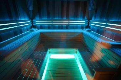 a bench in a bowling alley with blue lights at Penzion Koráb in Prague