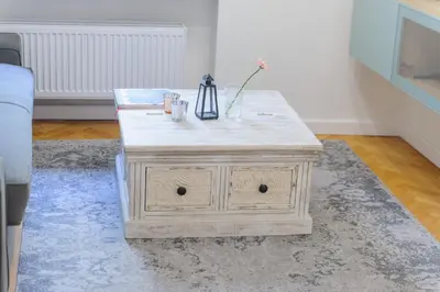 a wooden coffee table in a living room at Pinkova Apartments in Prague