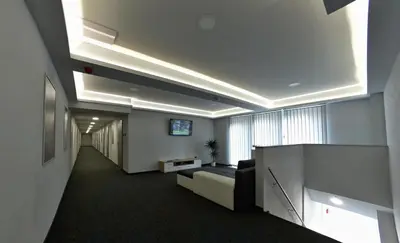 an office lobby with a couch in a room at Sporthotel Zimní stadion Benešov in Benešov
