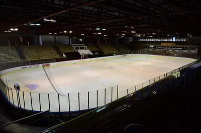 an arena with an ice hockey rink in it at Sporthotel Zimní stadion Benešov in Benešov
