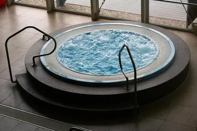 a large bath tub in a room with acean at Sporthotel Zimní stadion Benešov in Benešov
