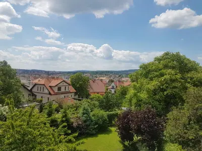 a view of a town with trees and houses at Apartman pod Svatou Horou in Příbram