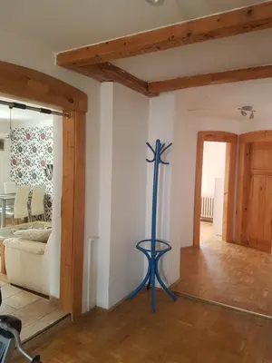a room with a blue pole in the middle of a room at Apartman pod Svatou Horou in Příbram