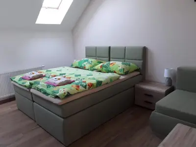 a bedroom with a bed in a room at Penzion Na Hrazi in Poděbrady