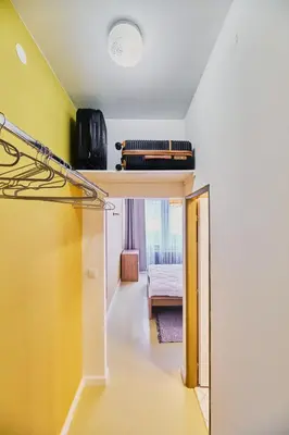 a room with a room with a bed and a mirror at Hostel Prazacka in Prague