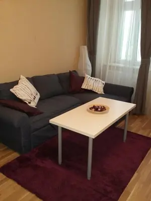 a living room with a couch and a coffee table at NOT POSSIBLE TO BOOK !!! Apartment Vltavska B in Prague