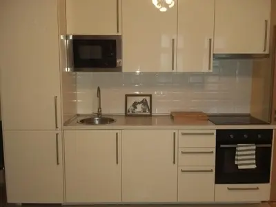 a kitchen with white cabinets and a sink at NOT POSSIBLE TO BOOK !!! Apartment Vltavska B in Prague