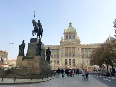 a large building with a statue in front of it at Prague Palace - Wenceslas Square in Prague