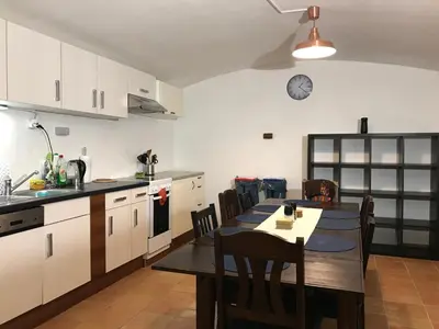 a kitchen and dining room with a table and chairs at Big Homebase with Billardtable in Prague