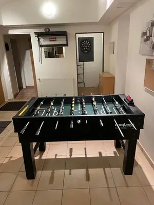 a large black table with weapons on top of it at Big Homebase with Billardtable in Prague