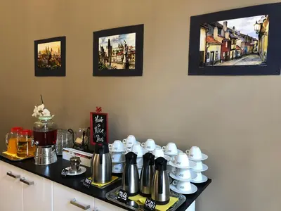 a counter with cups and teapots on it at Royal Road Residence in Prague