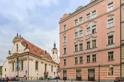 two buildings next to each other on a street at Hotel Caruso Old Town in Prague