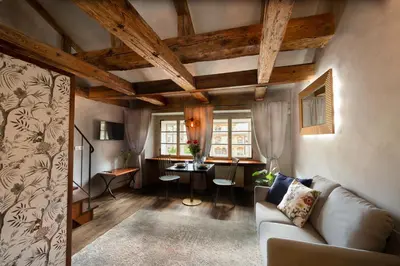 a living room with a couch and a table at Miss Sophie's Charles Bridge in Prague
