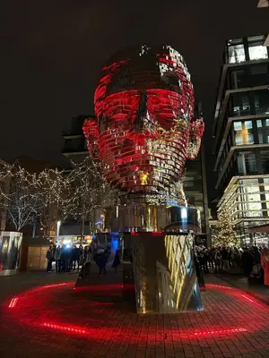 a large statue of a head with lights on it at Hostel Downtown in Prague
