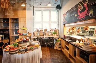a restaurant with a buffet of food on display at MOSAIC HOUSE Design Hotel in Prague