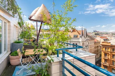 a balcony with a view of the city at MOSAIC HOUSE Design Hotel in Prague