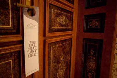 a door with a sign that says do not disturb at Deminka Palace in Prague