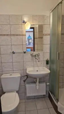 a bathroom with a toilet and a sink at Aaron in Prague