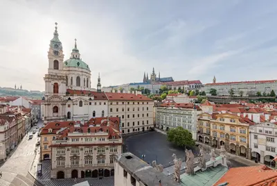 an aerial view of a city with a clock tower at Malostranská Residence in Prague