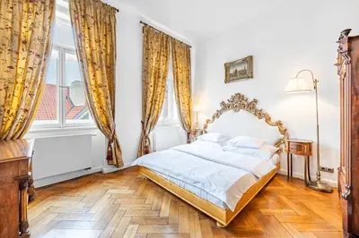 a bedroom with a bed and a window at Malostranská Residence in Prague