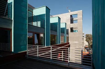 an external view of a building with a balcony at Fully renovated stylish duplex in a convenient location in Prague