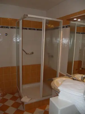 a bathroom with a shower and a sink at Motel U Krbu in Vestec