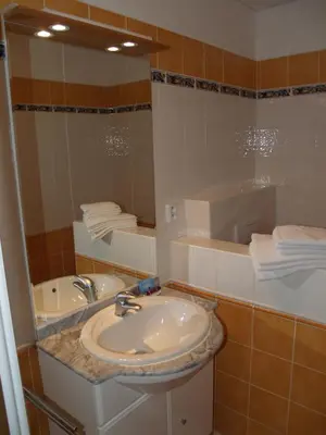 a bathroom with a sink and a mirror at Motel U Krbu in Vestec