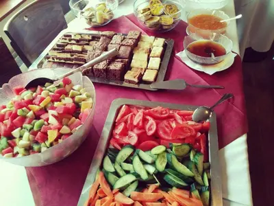 a table with a bunch of different types of food at Hotel S-centrum in Benešov