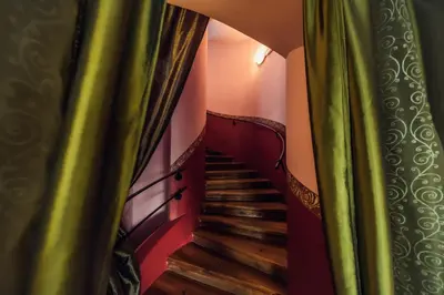 a view of a staircase through a curtain at Hotel Czechia in Prague