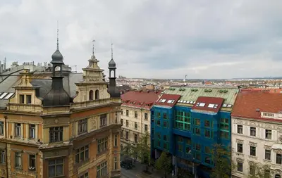 a view of a city with buildings and a clock tower at Hotel Ankora in Prague