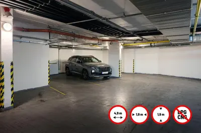 a parking garage with a car parked in it at Hotel Ankora in Prague