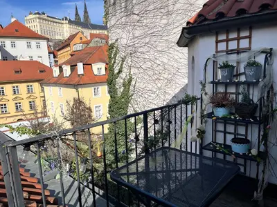 a balcony with a view of a city at Apartman Mala Strana -Piece and quiet in Prague