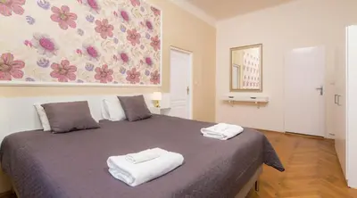 a bedroom with a bed with two towels on it at Vincanto Apartments Oldtown Prague1 in Prague