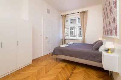 a small bedroom with a bed and a window at Vincanto Apartments Oldtown Prague1 in Prague