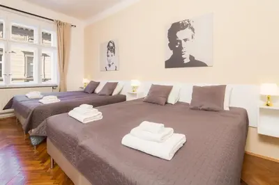a bedroom with two beds with towels on them at Vincanto Apartments Oldtown Prague1 in Prague