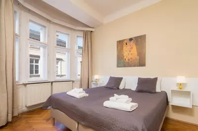 a bedroom with a bed with two towels on it at Vincanto Apartments Oldtown Prague1 in Prague