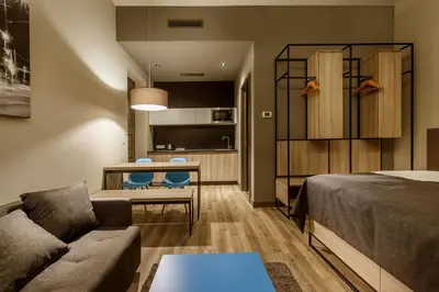 a living room with a couch and a table at Avenue Legerova 19 in Prague