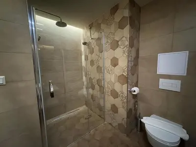 a bathroom with a shower and a toilet at Avenue Legerova 19 in Prague