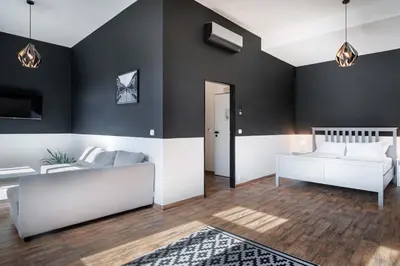 a living room with a couch and a table at Bohem Prague Hotel in Prague