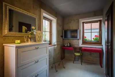 a bathroom with a red counter and a window at Penzion Čokolaterie in Třebenice